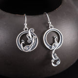 Asymmetric Silver Peacock Drop Earrings — product view 1