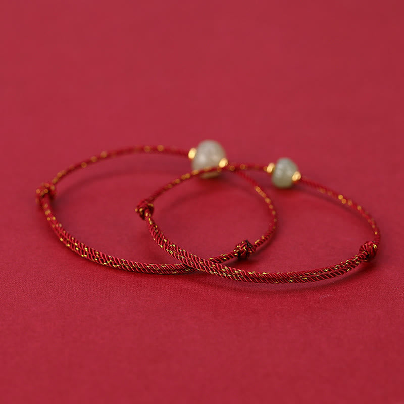 Carved Jade Lotus Red Cord Bracelet — product view 2