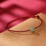 Carved Jade Lotus Red Cord Bracelet — product view 4