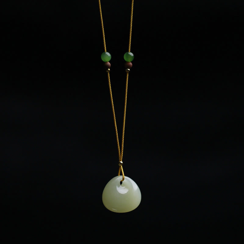 Carved Jade Pouch Cord Necklace — product view 1