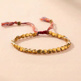 Pulsera trenzada con cuentas de cobre