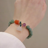 Jade and Amethyst Carved Bead Bracelet — detail view 2