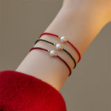 Single Pearl Braided Cord Bracelet — product view