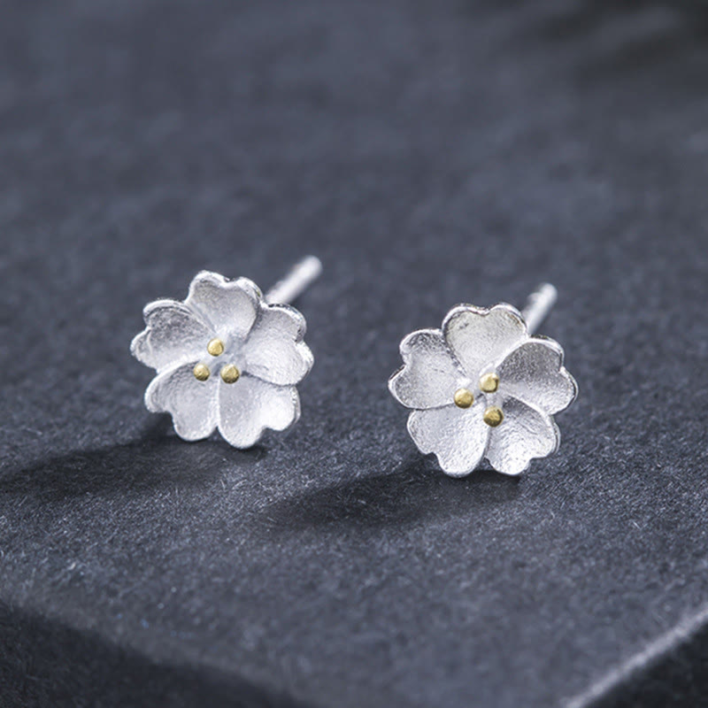 Tiny Silver Blossom Stud Earrings — product view 1